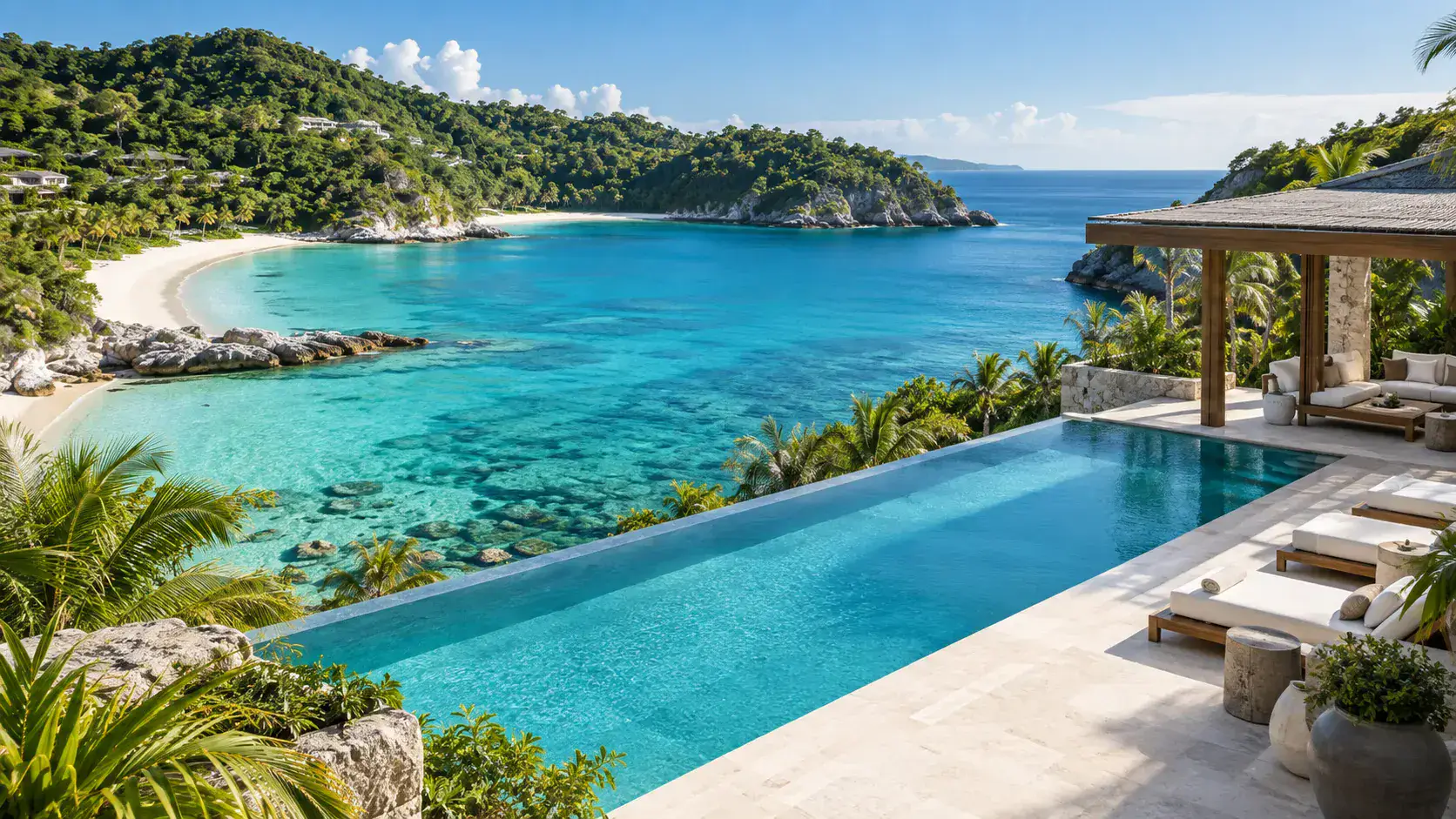 Oceanfront retreat with a turquoise cove, sandy beach and infinity pool
